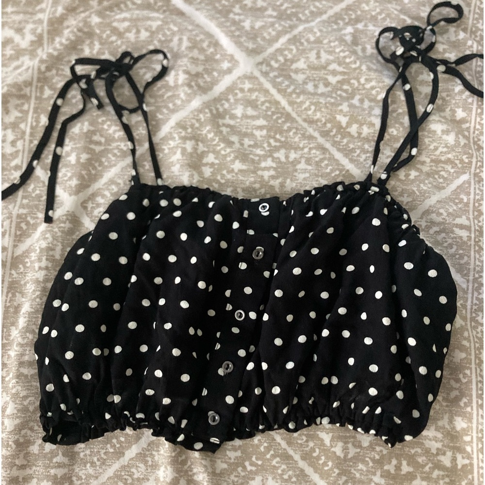 Free people crop top. Black with white polka dots. Size 6.